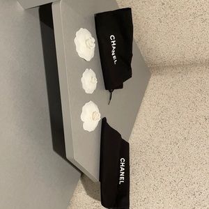 Chanel flowers and shoe bags